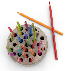 A photo of colored pencils sitting in a wooden pencil holder.