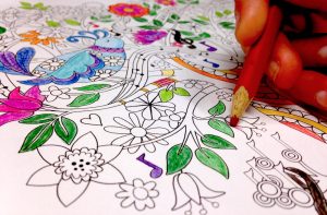 Katherine colors her free downloadable coloring sheet from Amazing Grace by Zondervan.